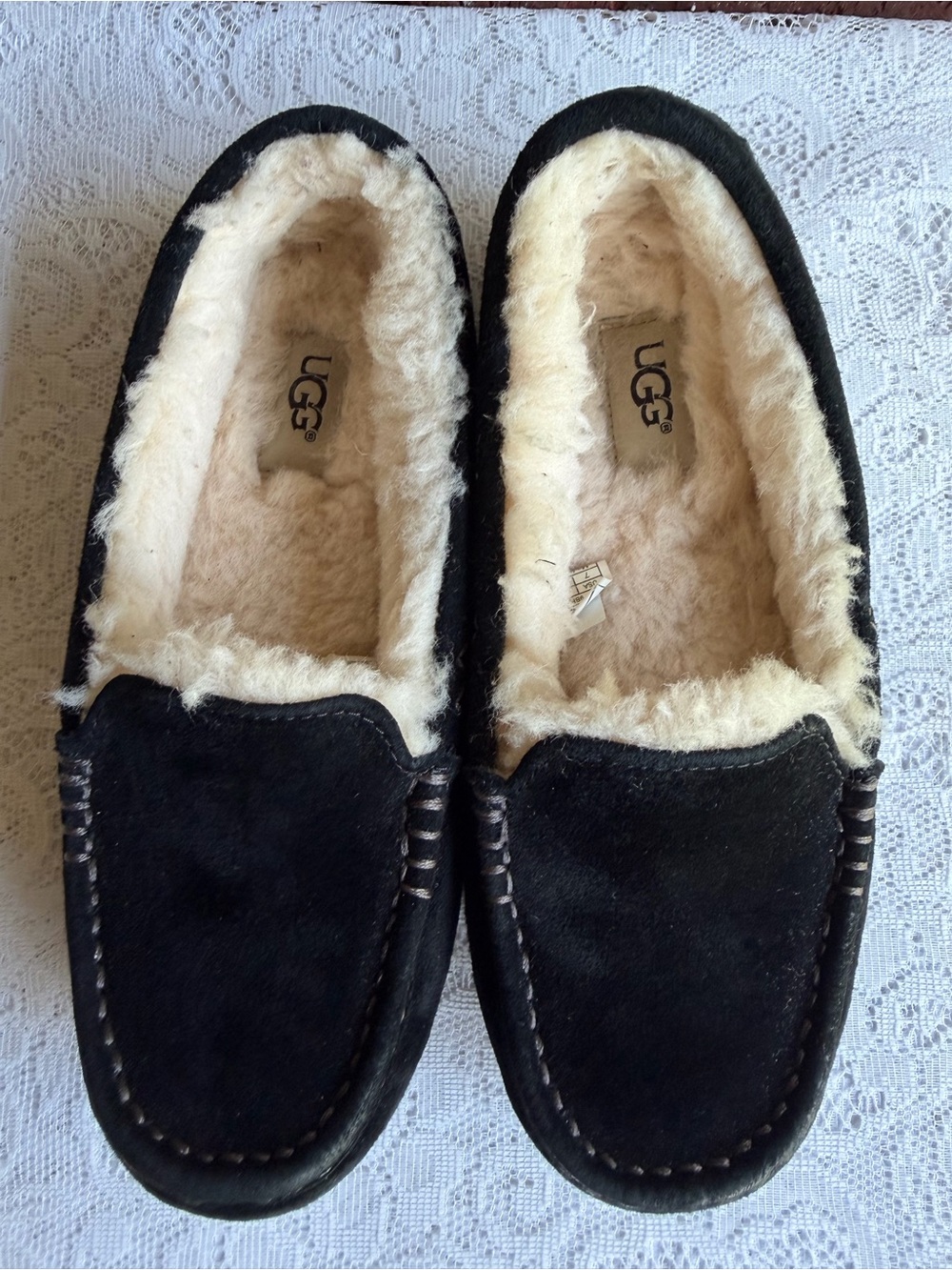 UGG Ansley Water-Resistant Slippers in the black suede colorway.